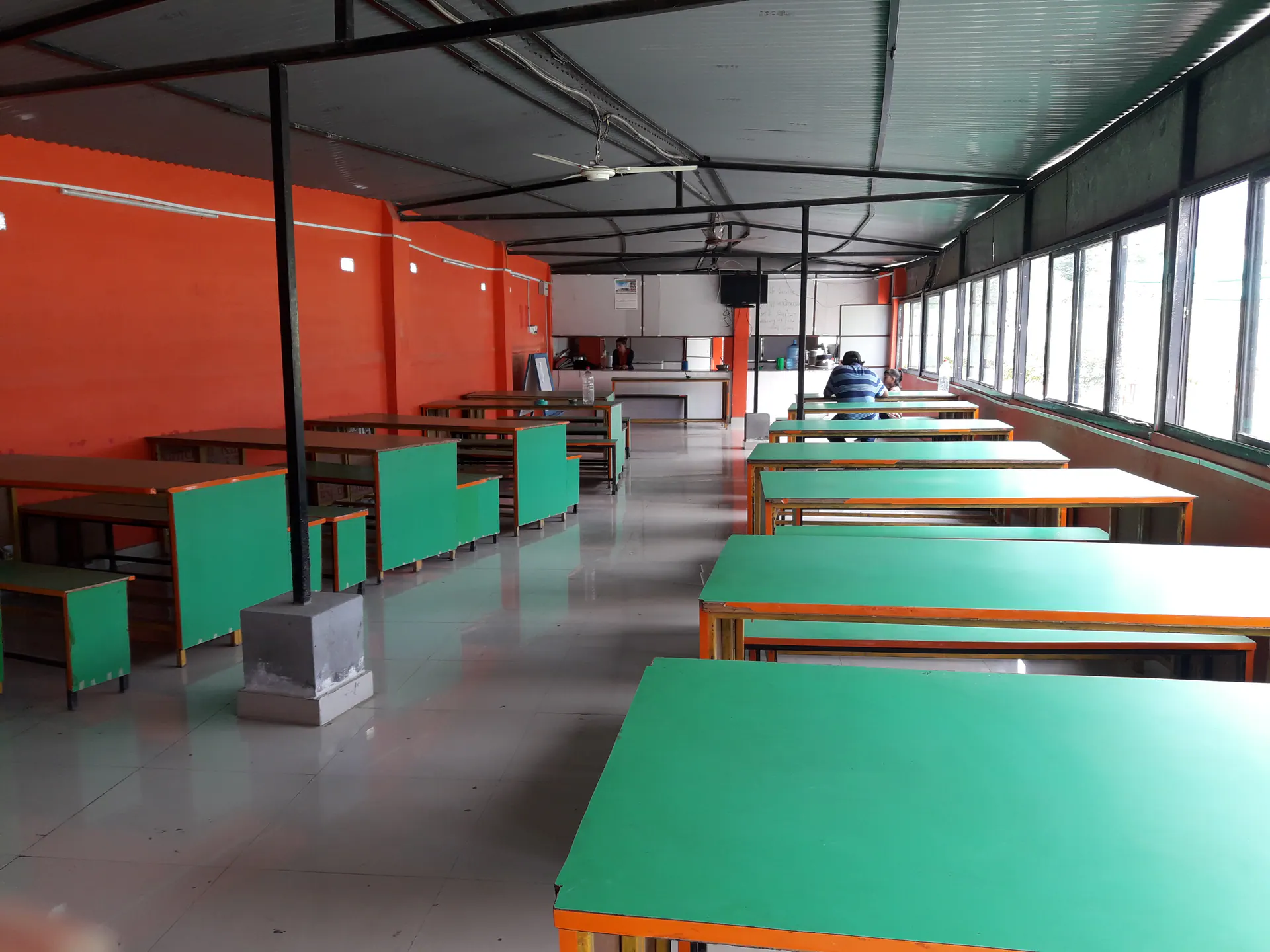 Tables and seating arranged inside the campus canteen