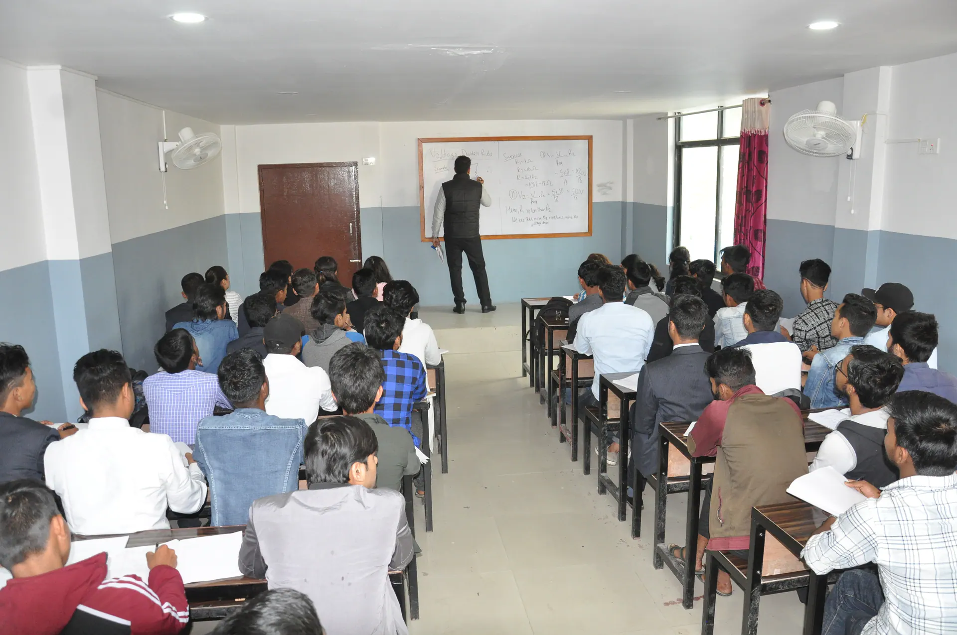 An engineering lecture in progress with students seated in the classroom