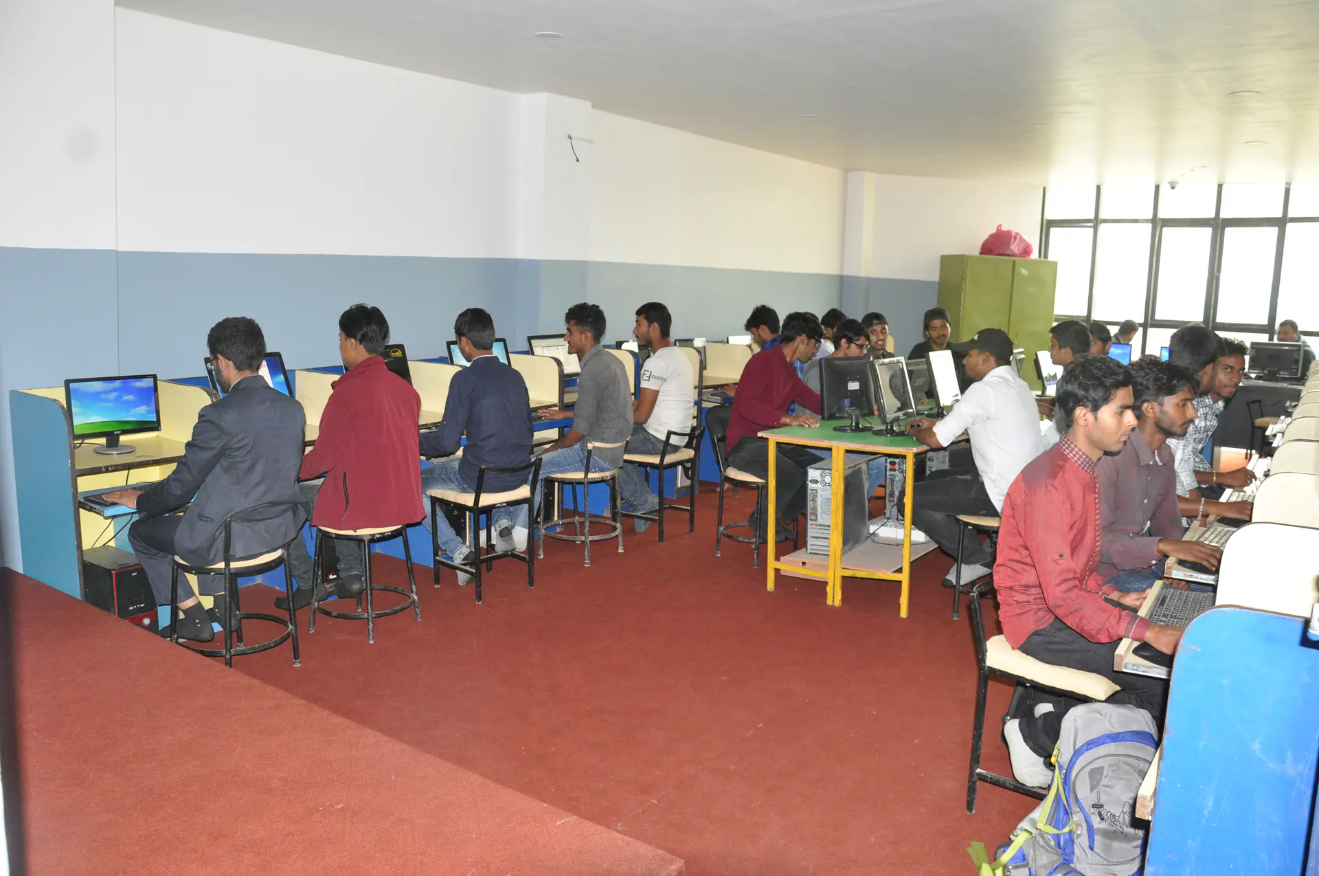 Computer engineering students working at desktop workstations in the computer laboratory