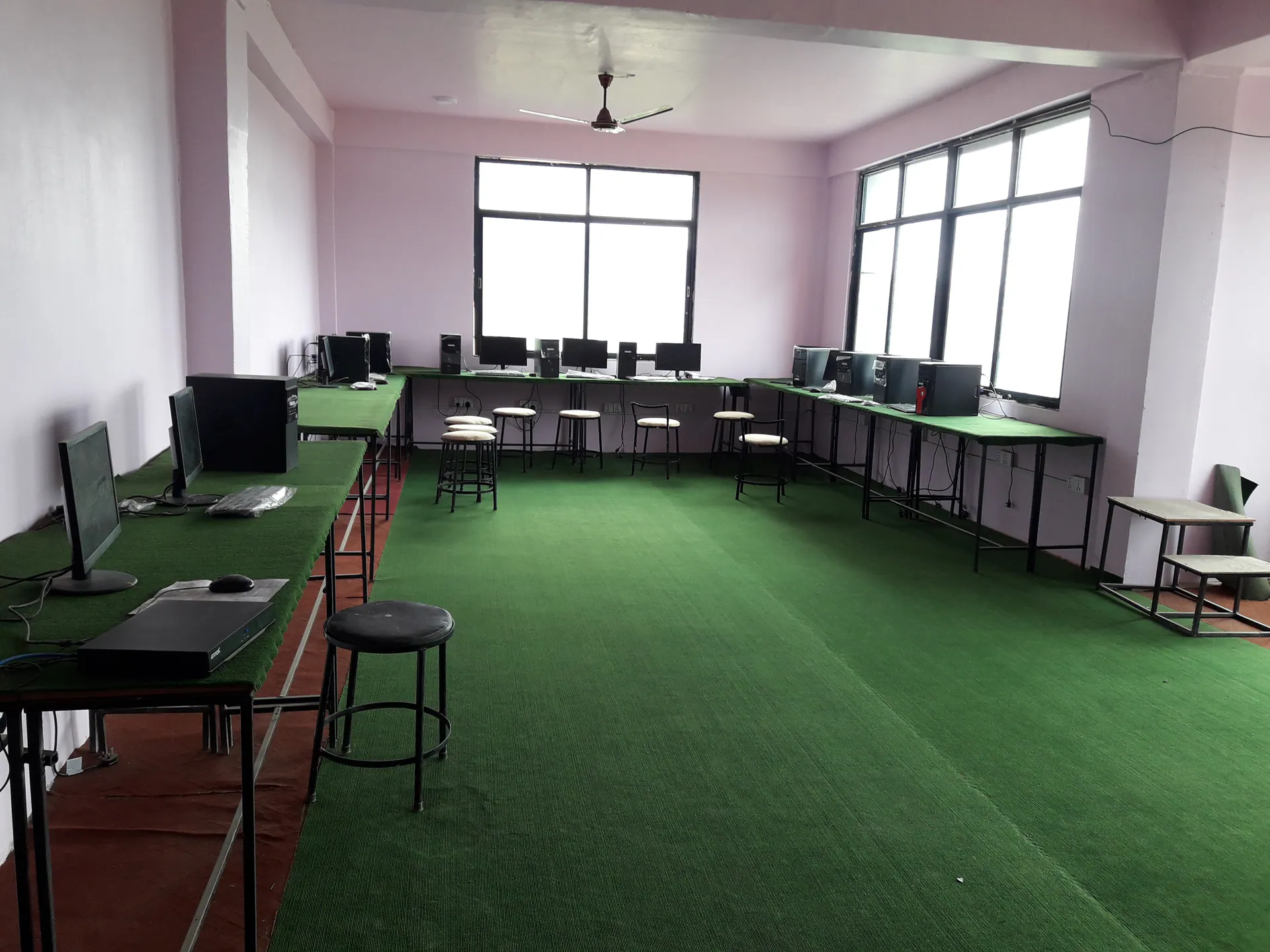 Desktop workstations arranged around a computer laboratory