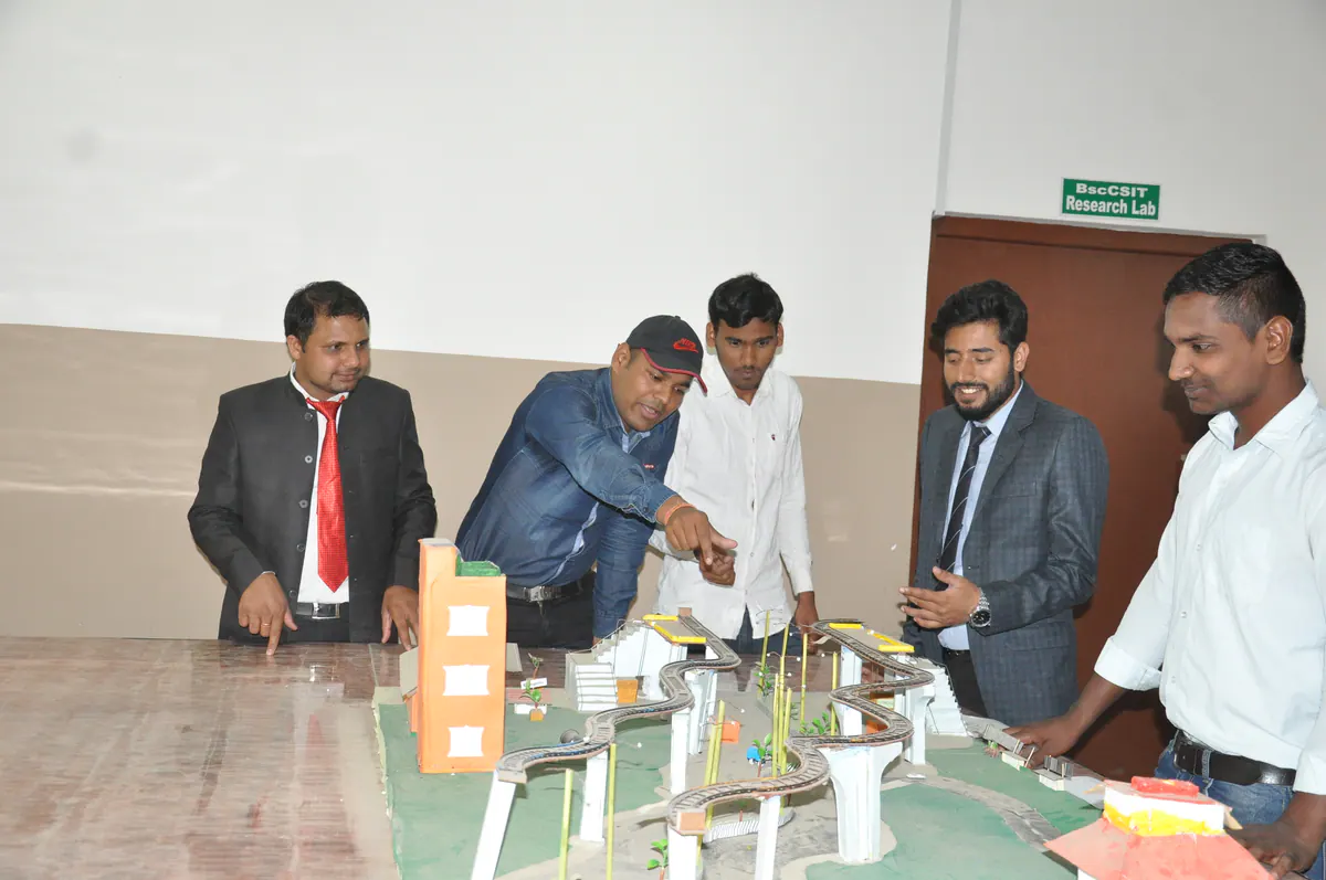 Engineering students reviewing a working model together