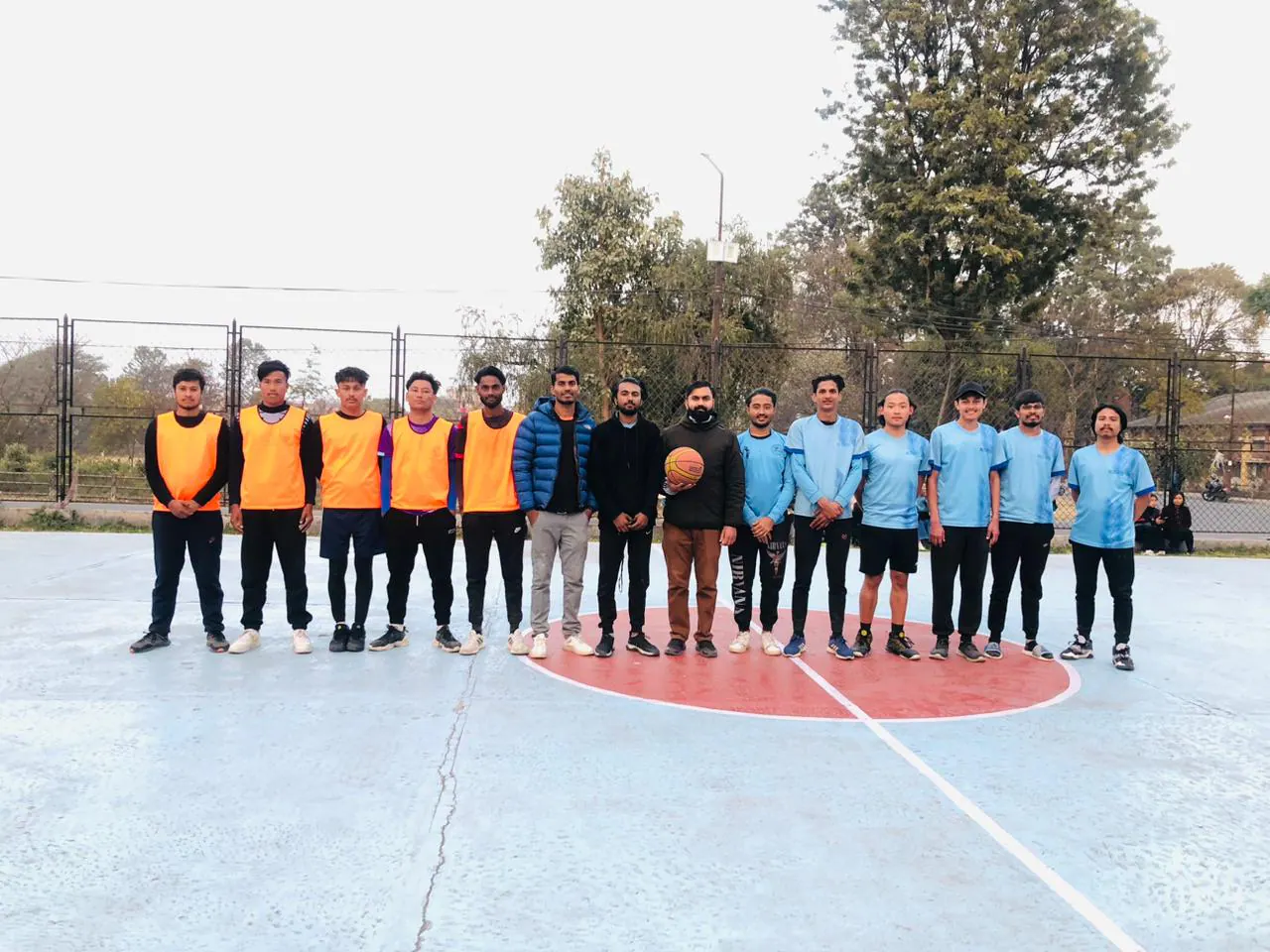 ICE students gathered together on an outdoor sports field